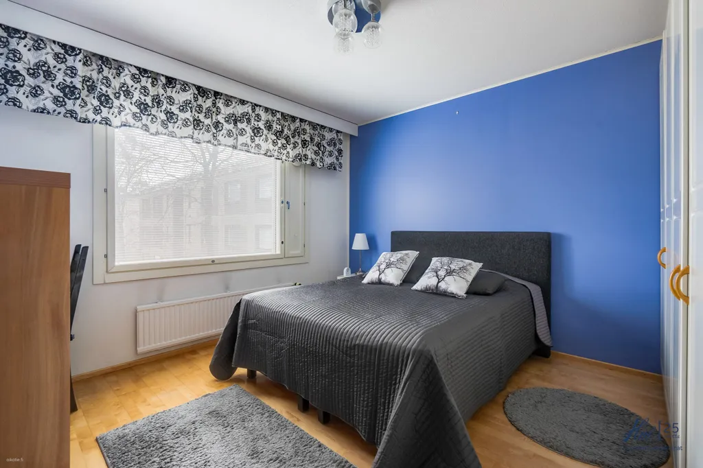 Bedrooms - Two-Bedroom Flat with Garden View in Runosmäki