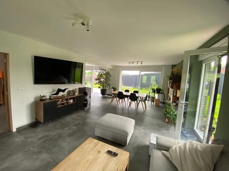 Living Room - 6-Bed House with Solar Panels in Green Setting