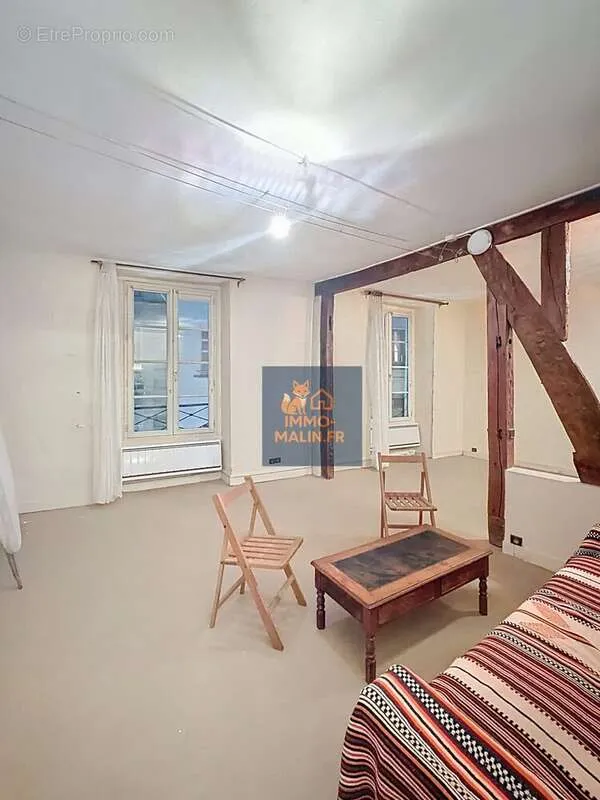 Living Room - Bright Studio Apartment with Poutres in Paris 4th