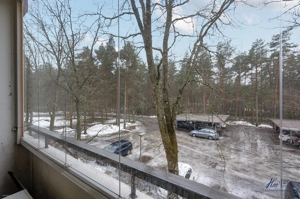 Balcony - Two-Bedroom Flat with Garden View in Runosmäki