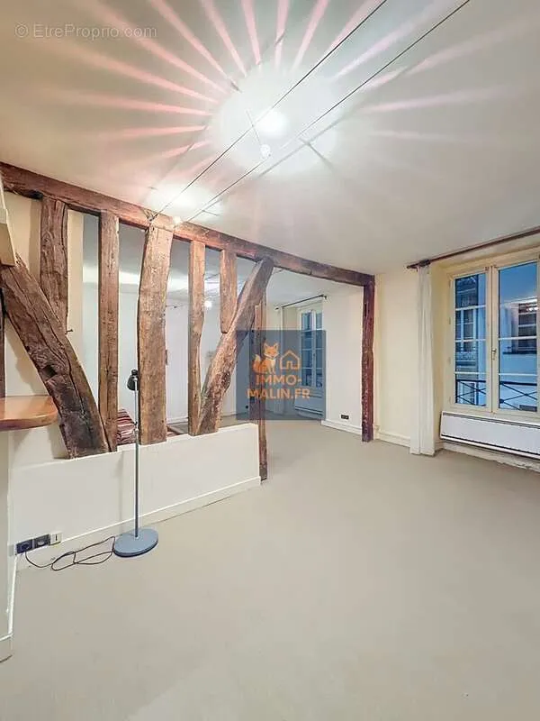 Living Room - Bright Studio Apartment with Poutres in Paris 4th