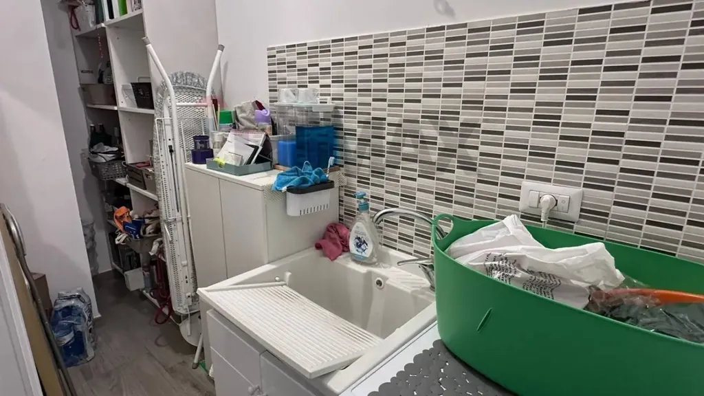 Utility Room - Modern Apartment with Balcony in Cosenza
