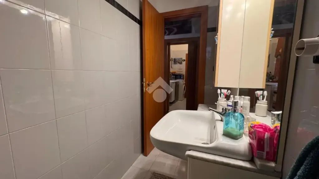 Bathrooms - Rusticated Two-Bedroom Apartment in Bari
