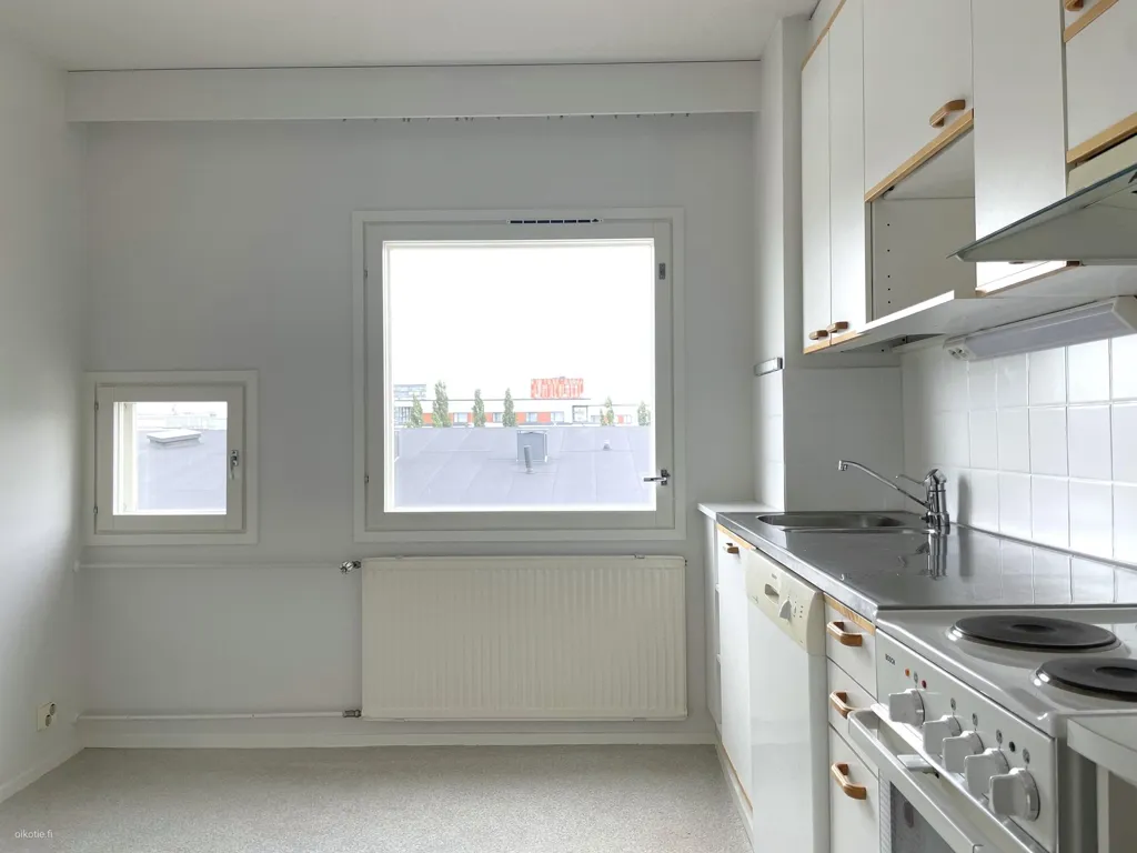 Kitchen - Spacious Apartment with Balcony in Etu-Lyötty, Oulu