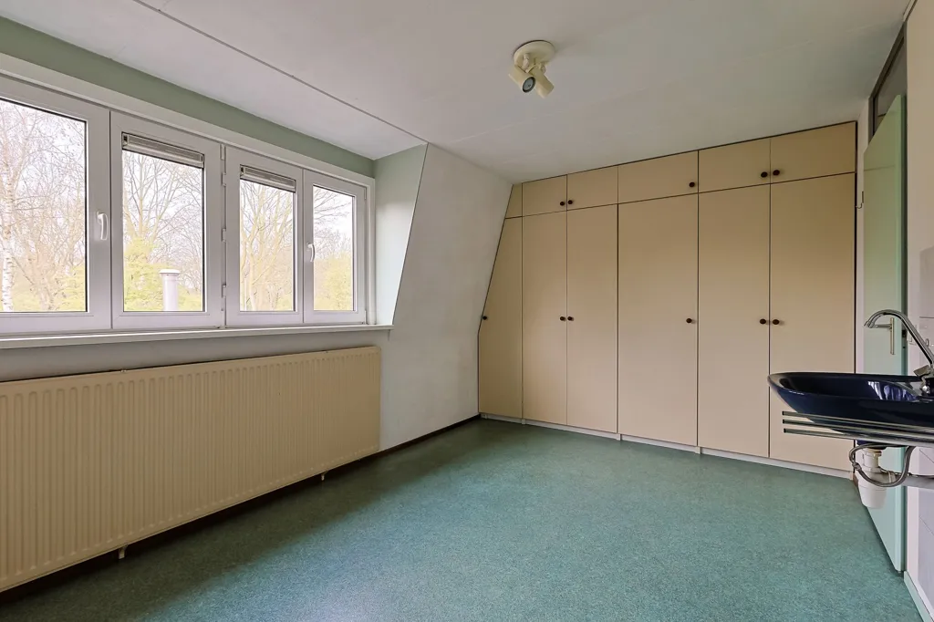Magamistoad - Playfully Designed Corner Home with Patio in Leiderdorp