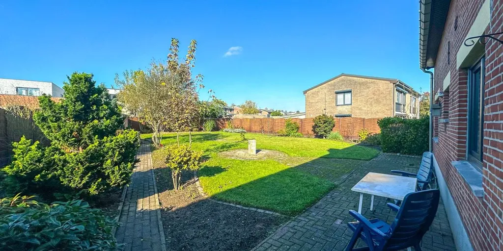 Jardin - Appartement Charmant avec Garage à Heusden