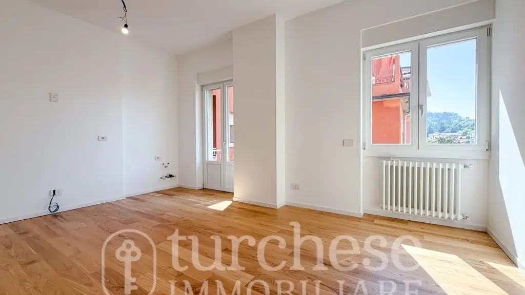 Living Room - Modernised Two-Bedroom Apartment in Bergamo