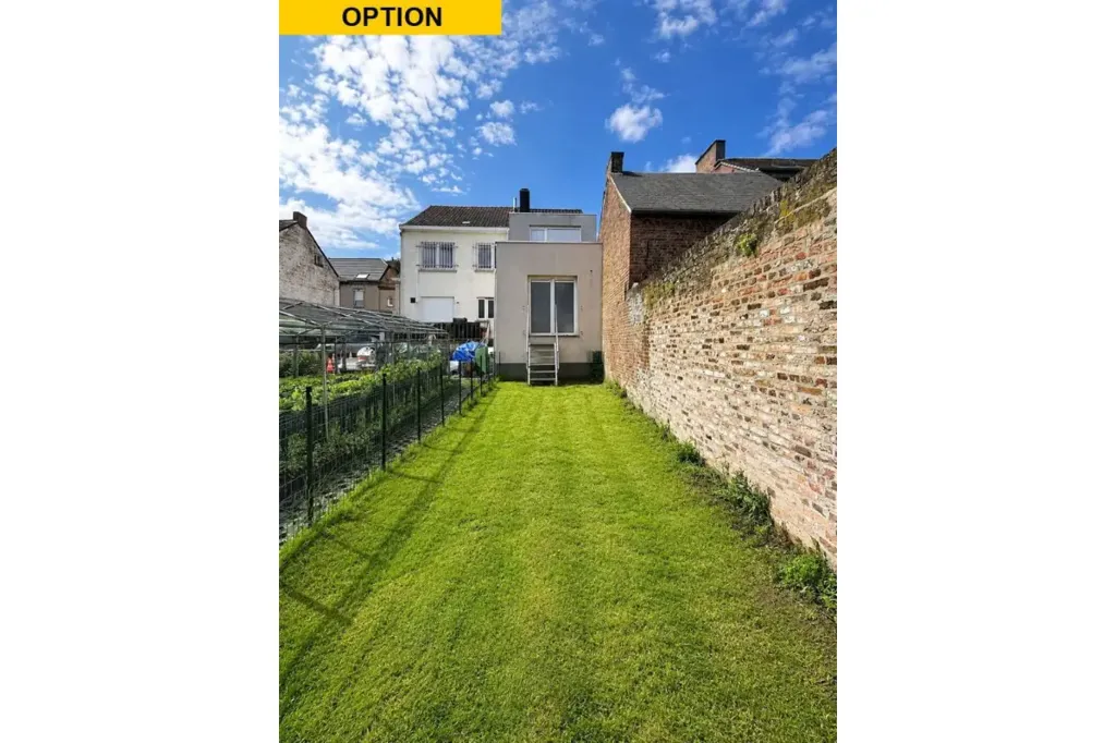 Aed - Mixed-Use Building with Garden in Orp-Jauche
