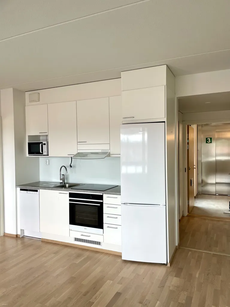 Kitchen - Bright Apartment with Balcony in Nummela