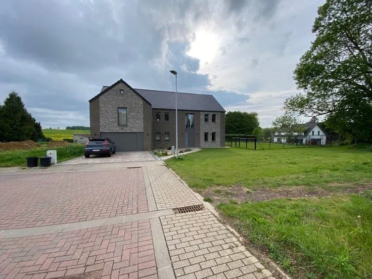 Exterior - 6-Bed House with Solar Panels in Green Setting