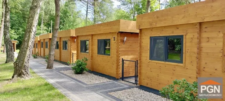House with Gastronomic Outbuilding near Beach in Forest