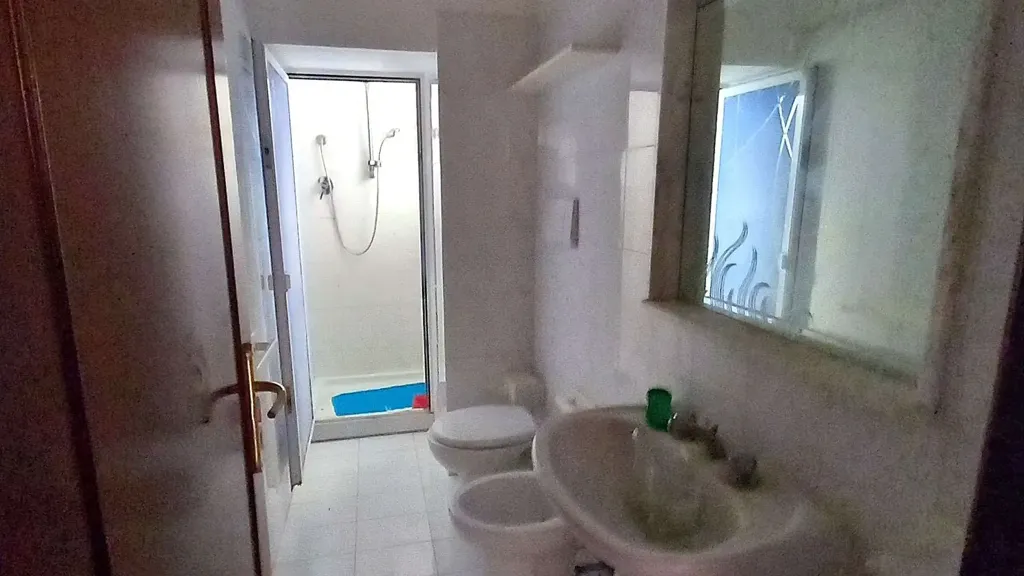 Bathrooms - Three-Bedroom Apartment with Private Garden in Osimo