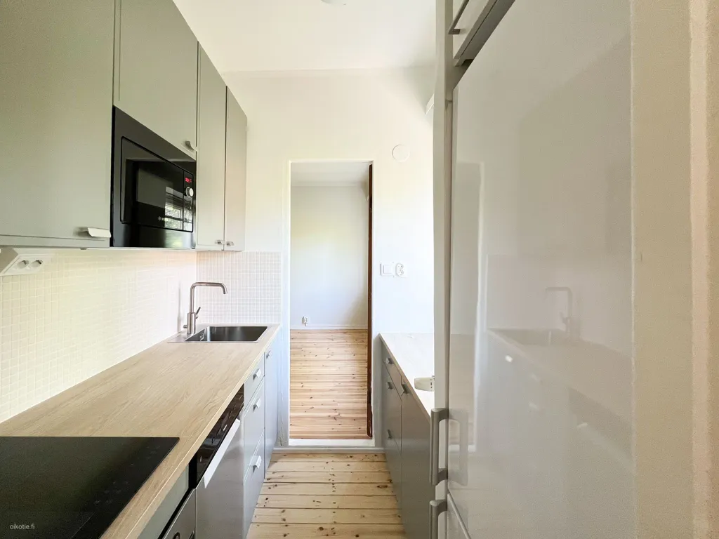 Kitchen - Upper Floor Apartment with Balcony in Toukola, Helsinki