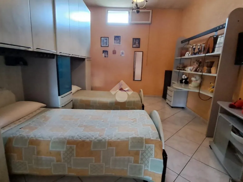 Bedrooms - Three-Bedroom Apartment with Fireplace in San Marcellino