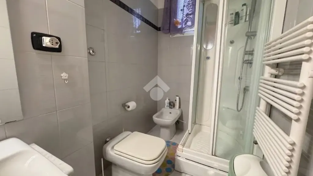 Bathrooms - Rusticated Two-Bedroom Apartment in Bari
