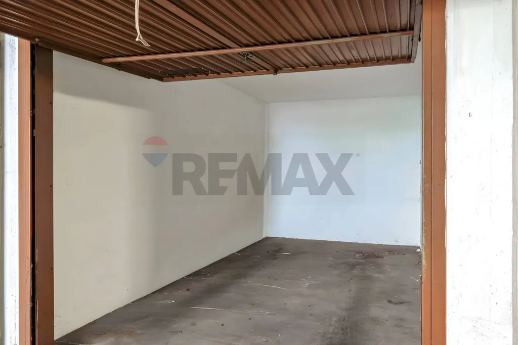 Garage - Rustic Triplex with Balcony in Brescia