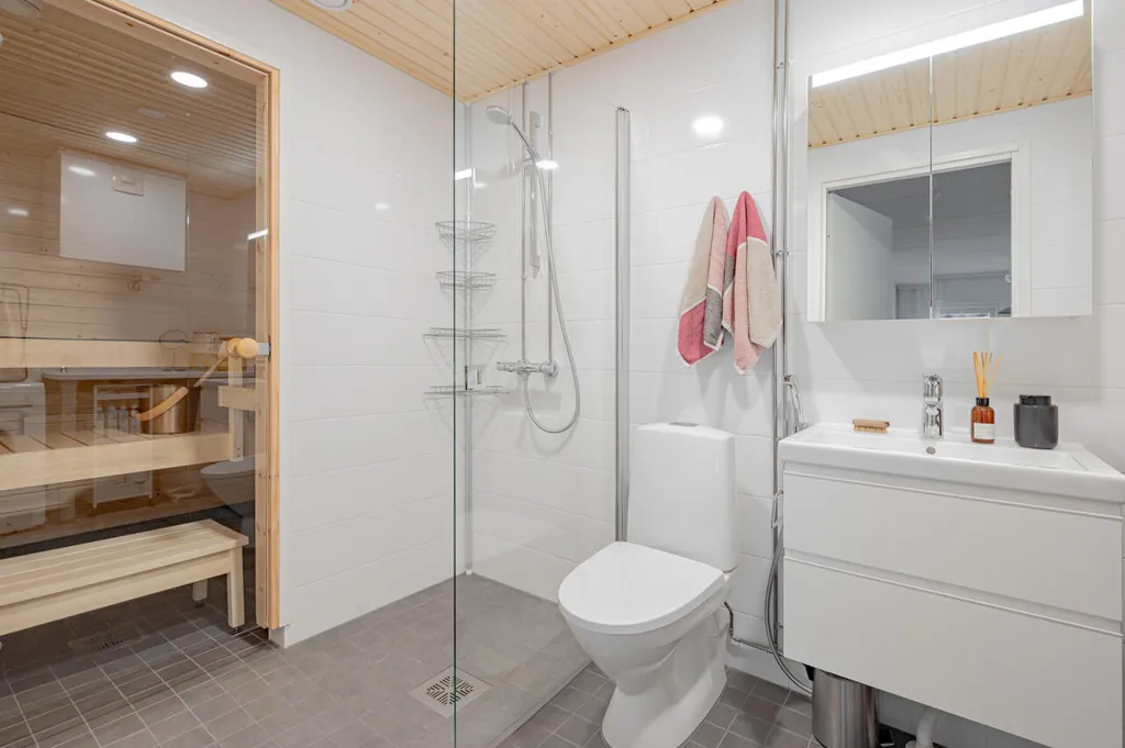 Bathrooms - 3-Bedroom Apartment with Balcony in Helsinki