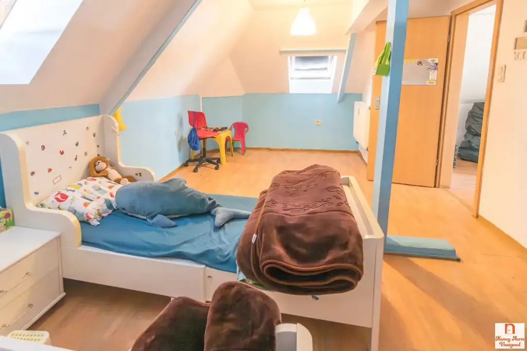 Bedrooms - Apartment Building with High Visibility in Herk-de-Stad