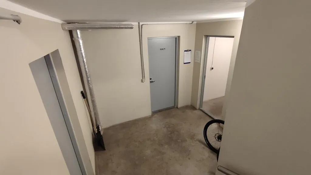 Garage - Two-Bedroom Apartment with Balcony in Central Location