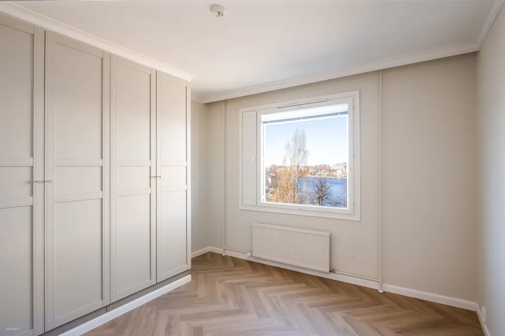Schlafzimmer - Fully Renovated Apartment with River Views in Oulu