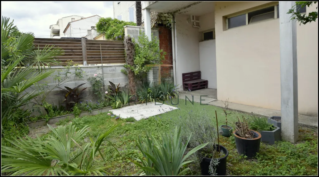 Jardin - Appartement avec Garage et Terrasse dans le Quartier Recherché