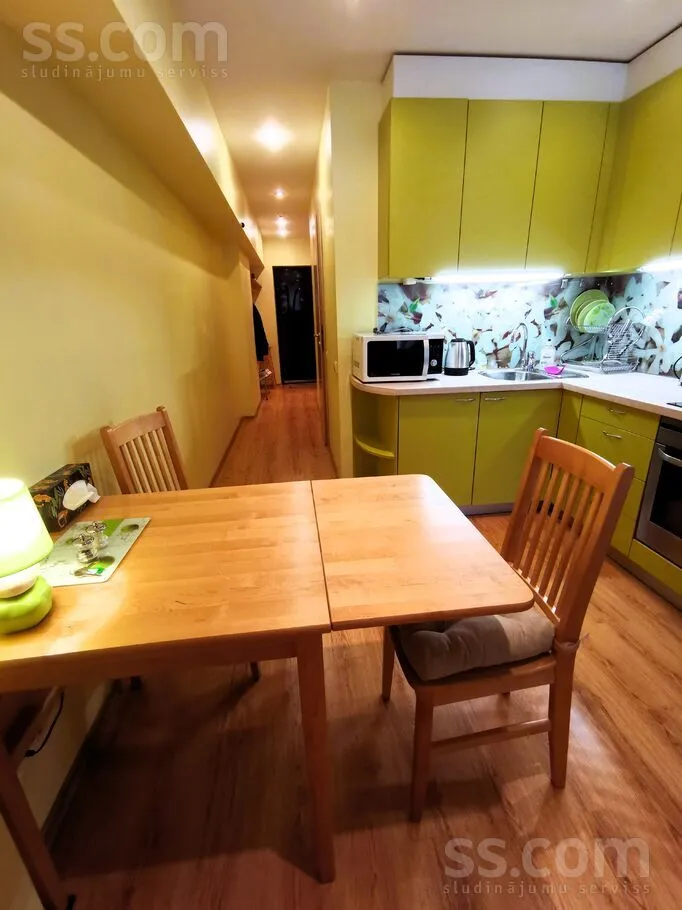 Dining Room - Bright Apartment with Secure Parking in Riga Centre