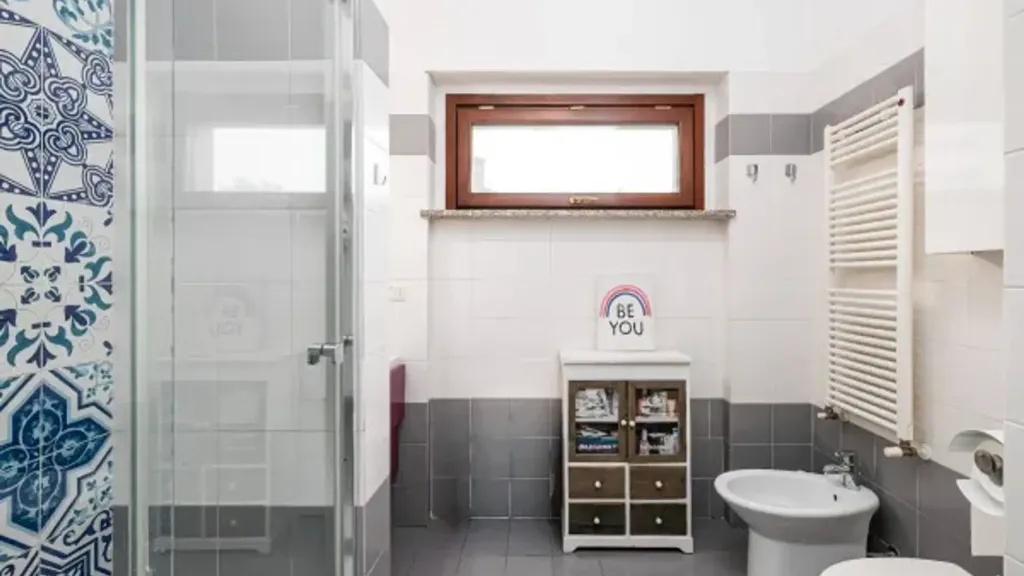 Bathrooms - Duplex with Panoramic Terrace in San Donato Milanese
