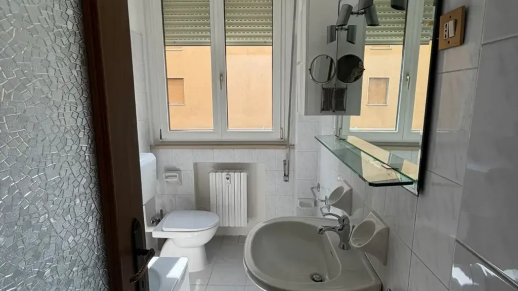 Bathrooms - Three-Bedroom Apartment with Balcony in Parma