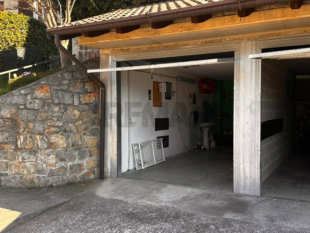 Garage - Mountain View Apartment with Garden in Orezzo