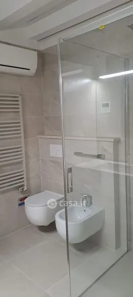 Bathrooms - Elegant Trilocale with Private Patio in Como