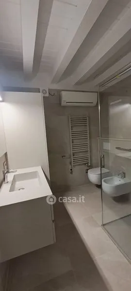 Bathrooms - Elegant Trilocale with Private Patio in Como